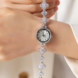 Reloj dorado de acero floral