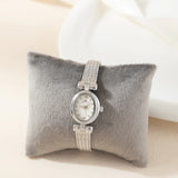 Reloj metálico de esfera ovalada