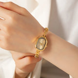 Reloj Ovalado de Acero Dorado