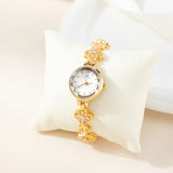 Reloj dorado de acero floral