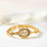 Reloj Ovalado de Acero Dorado